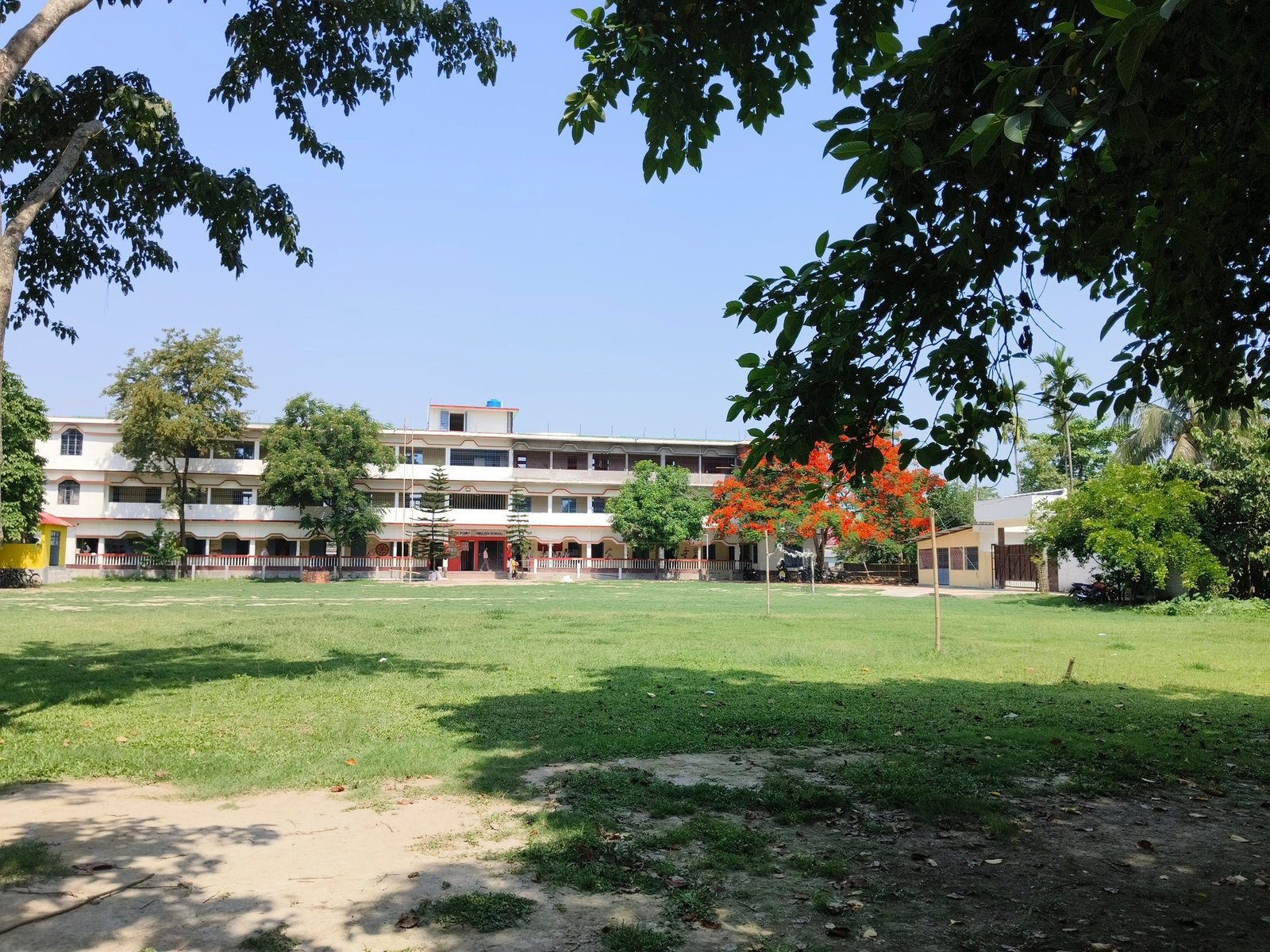 The main building of South Point English School seen across the playing field